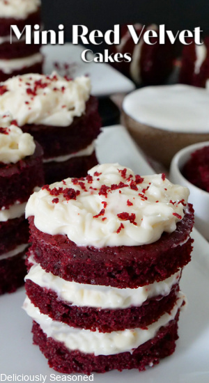 A white plate with 3 mini red velvet cakes on it.