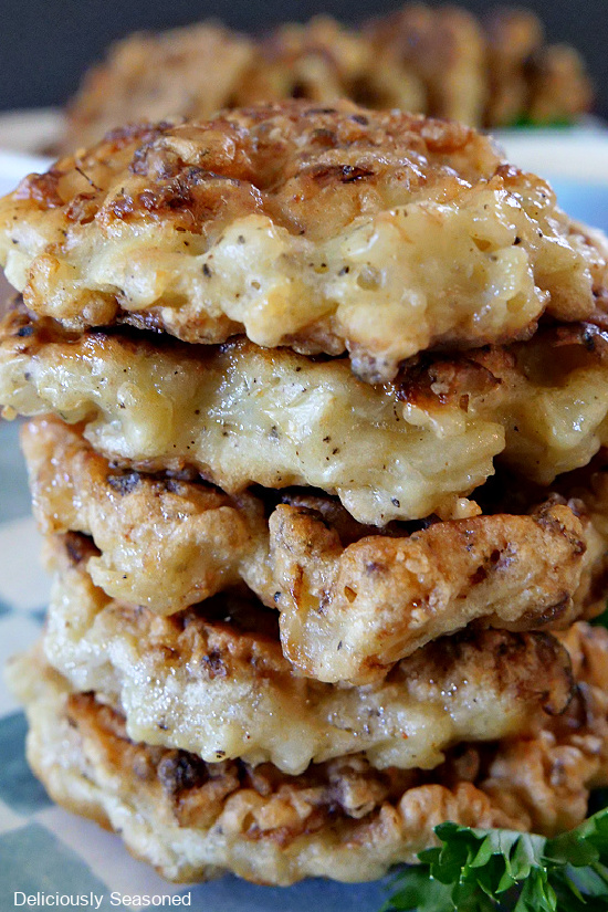 A close up of a stack of cauliflower fritters.