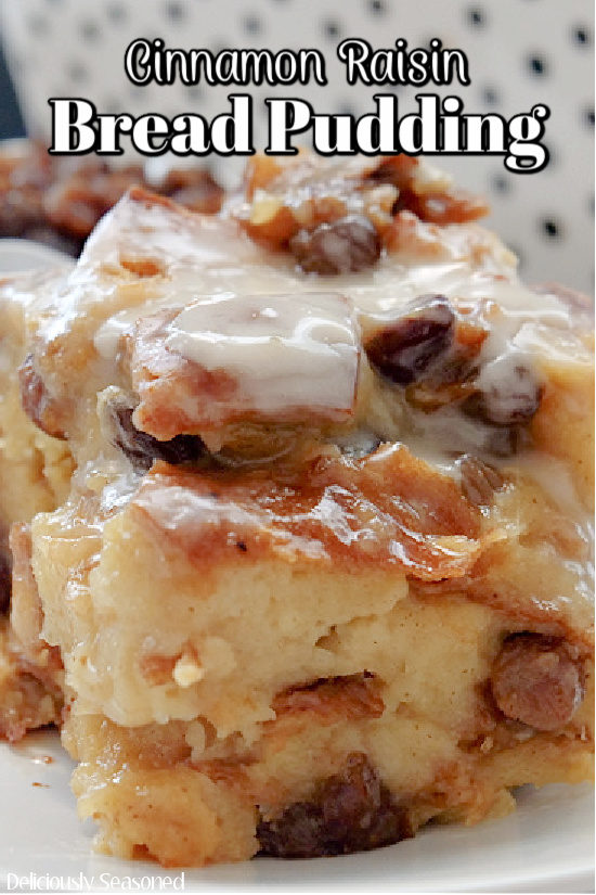 A close up picture of cinnamon raisin bread pudding topped with a sweet glaze.