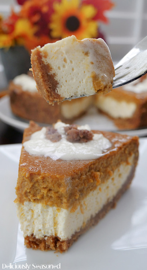 A slice of pumpkin cheesecake with a bite taken out of it, sitting on a fork.