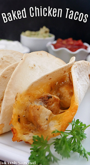 A few baked chicken tacos on a white plate with the title of the recipe at the top of the picture.