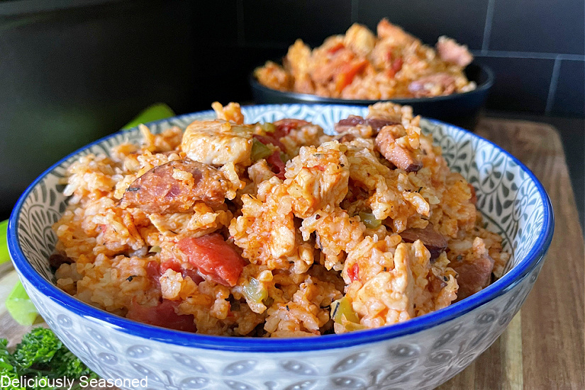 A blue and white bowl filled with jambalaya.