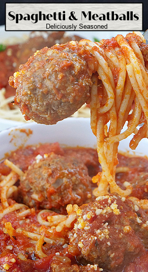 A bite of spaghetti and a meatball on a fork.