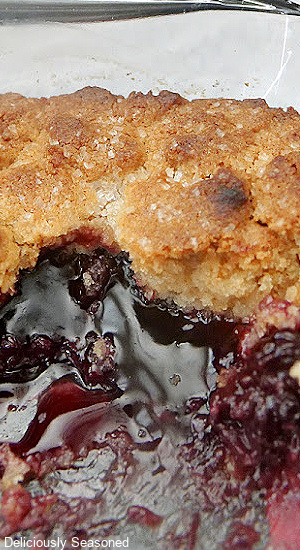 A close up of blackberry cobbler in the baking dish.