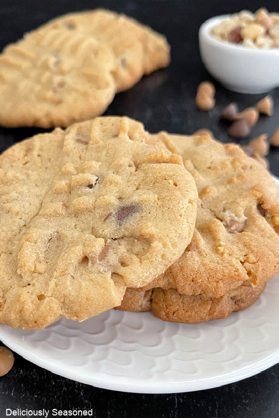 A close up of peanut butter cookies with peanut butter and chocolate chip morsels.
