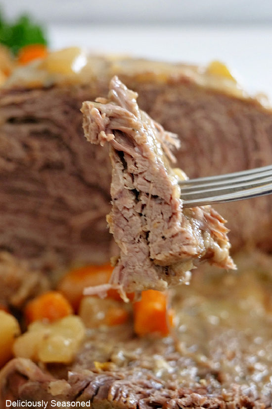 A close up shot of a bite of beef shoulder roast.