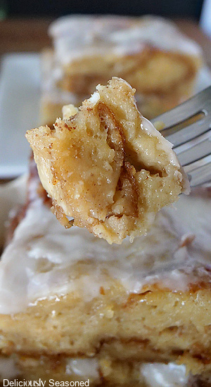 A bite of bread pudding on a fork.