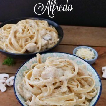 Two bowls filled with chicken fettuccine alfredo