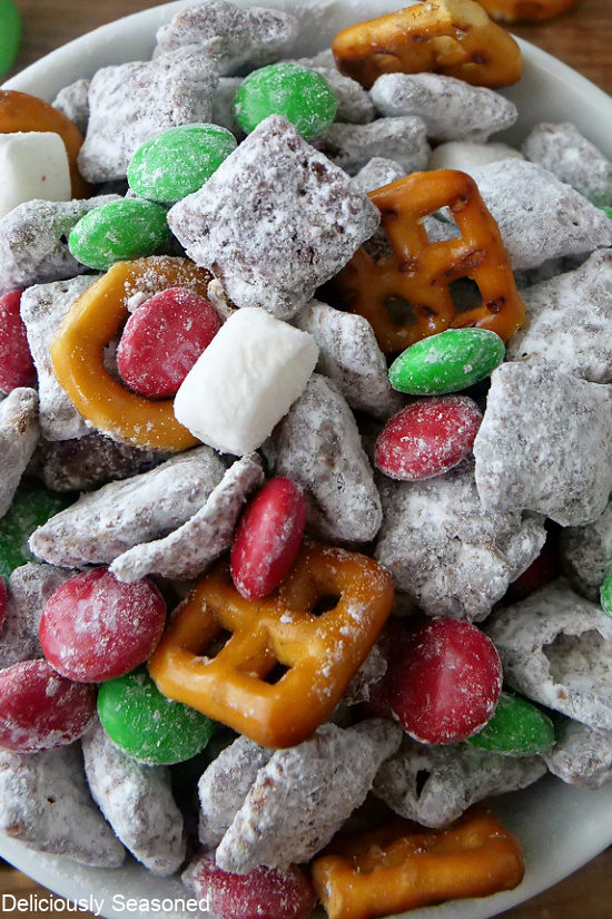 A super close up of the holiday snack mix, muddy buddies.