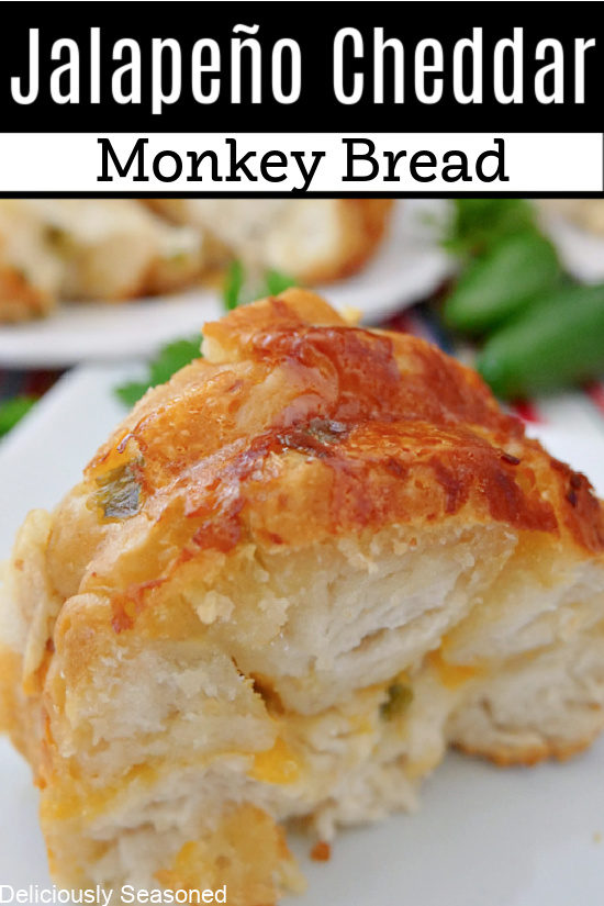 A slice of jalapeno cheddar monkey bread on a white plate with the title of the recipe at the top of the photo.