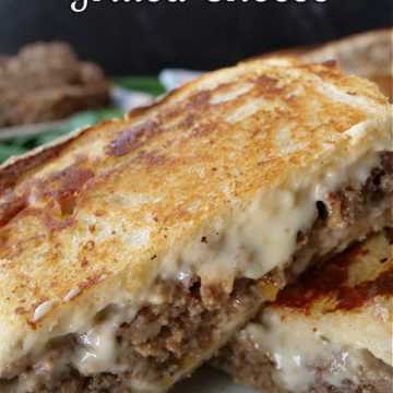 A meatloaf grilled cheese cut in half.