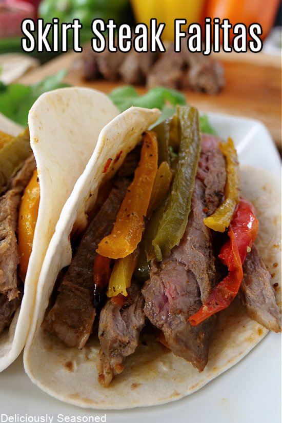 Steak fajitas with colored bell peppers, onions, in a flour tortilla.
