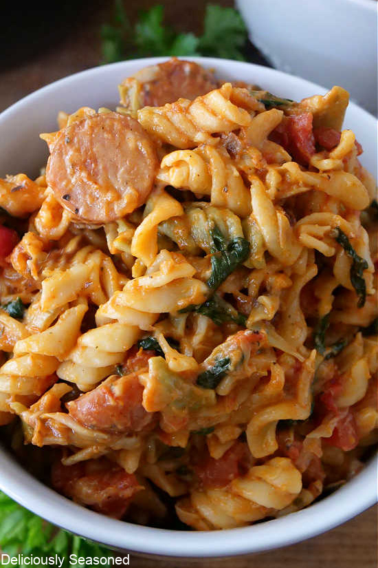 A close up of a white bowl filled with this pasta recipe.
