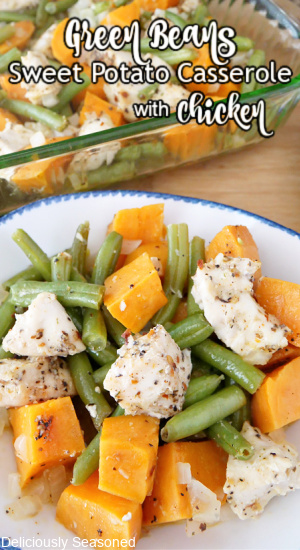 Chicken, green beans and sweet potatoes in a white bowl with blue trim.