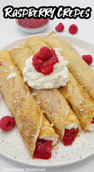 Four crepes on a white plate.