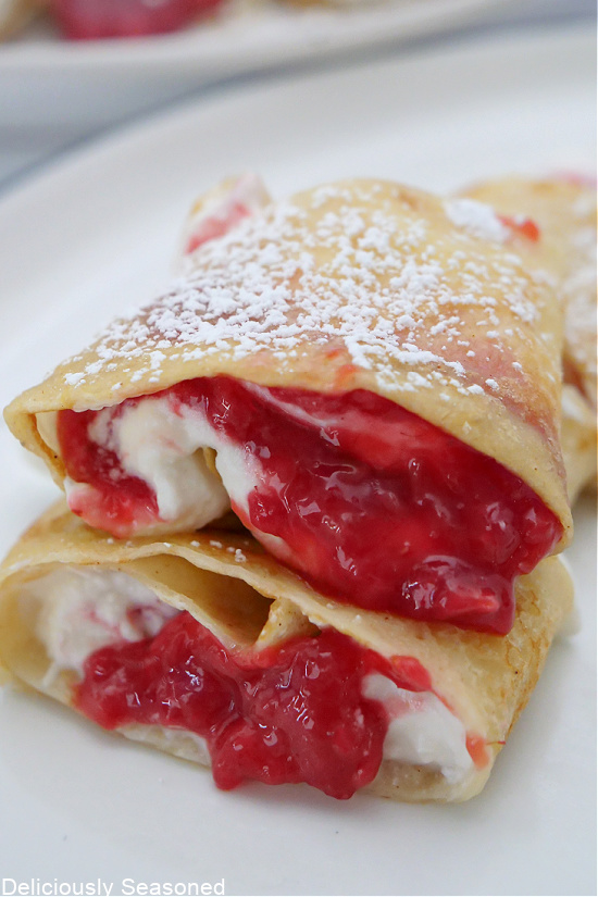 A close up of two crepes place on top of each other.