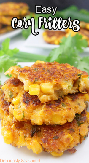 A title pic with three corn fritters stacked up on a white plate.