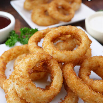 A title pic with a pile of onion rings on a white plate.