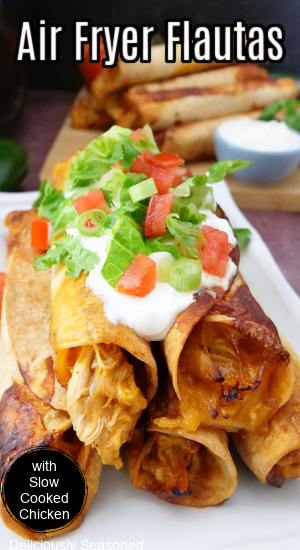 Air fryer chicken flautas stacked on a white plate with the title at the top.