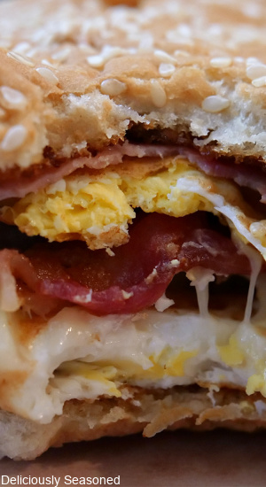 A close up photo of the middle of an ultimate breakfast sandwich.