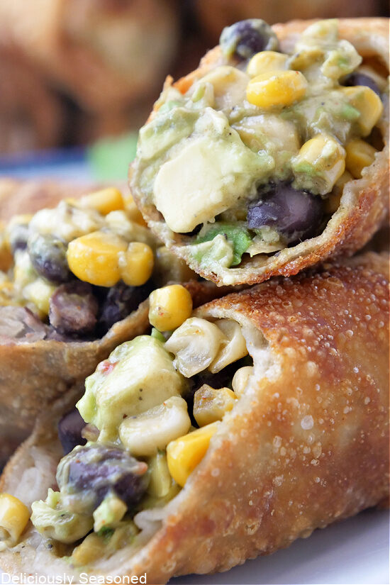 A close up of avocado egg rolls.