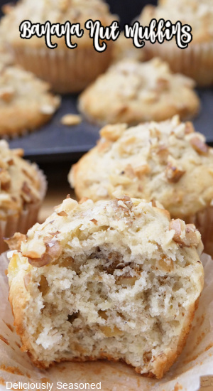 A close up of a banana nut muffin with a bite taken out of it.