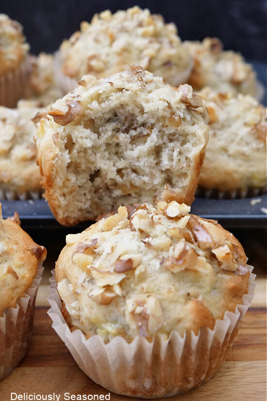 A close up of a few banana nut muffins .
