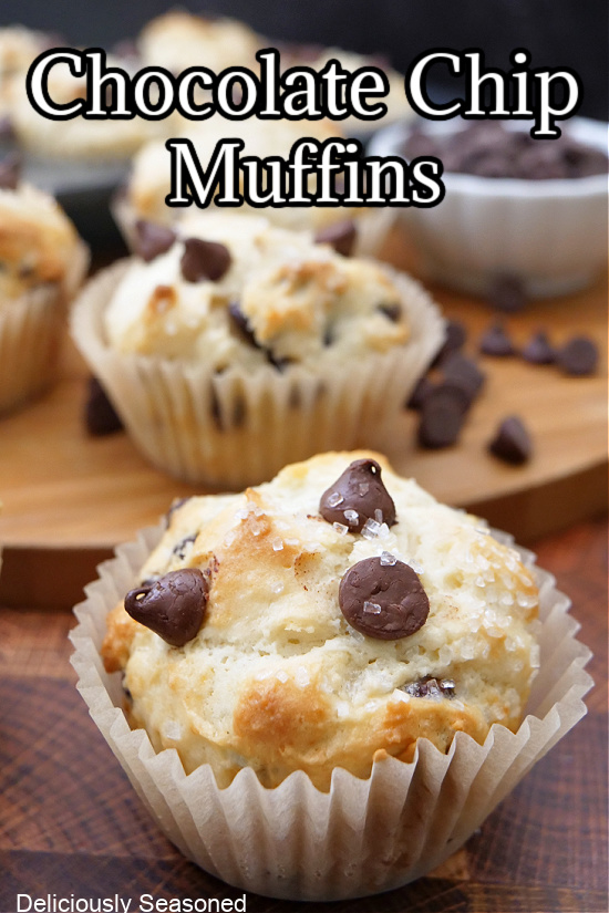 A close up photo of a muffin filled with melty chocolate chips.