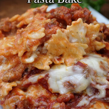 A close up photo of a large serving of Italian sausage pasta bake.