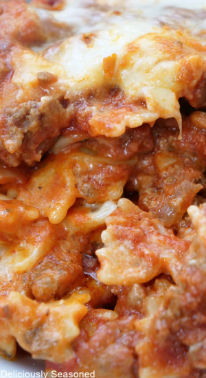 A close up photo of cheesy pasta bake.