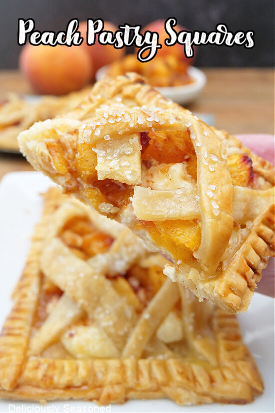 A close up of a peach pastry square cut in half.