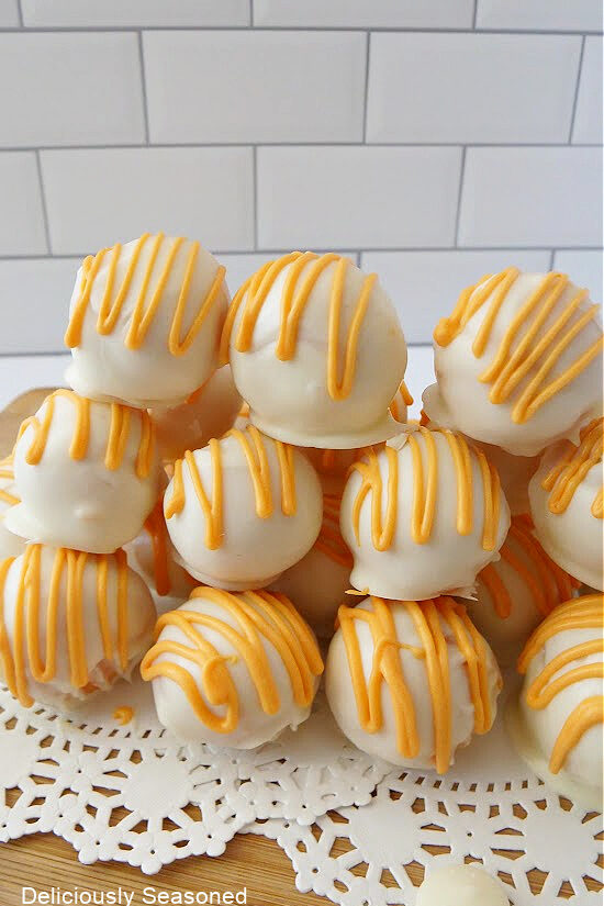 A stack of orange cake balls.