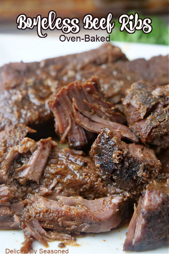 A close up of tender boneless beef ribs on a white plate.