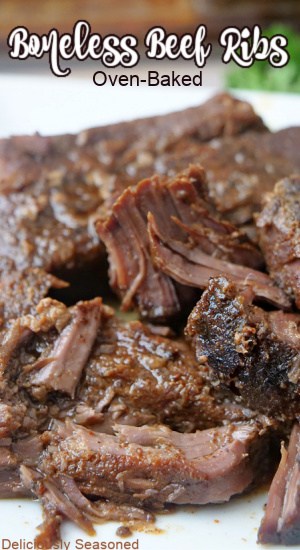 A close up of a white plate with oven-baked ribs on it.