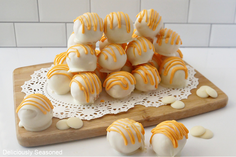 A horizontal photo of orange cake balls.