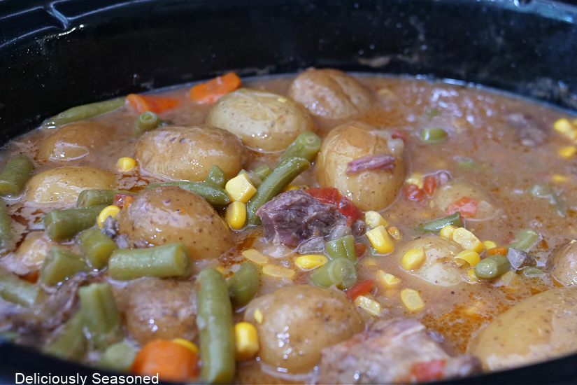 A large crock pot filled with beef stew.