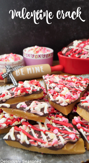A sliver tray with pieces of Valentine Crack candy toffee on it with.