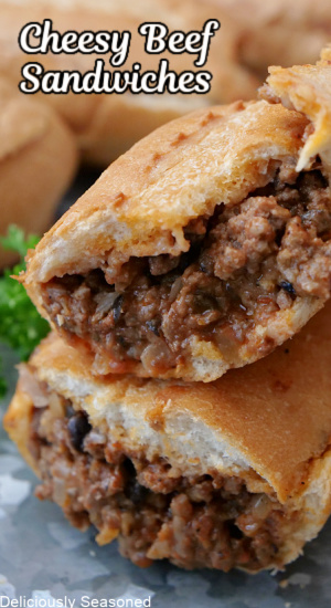 A close up of two halves of a hoagie roll stuffed with ground beef mixture.