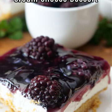 A slice of cream cheese blackberry dessert on a white plate.