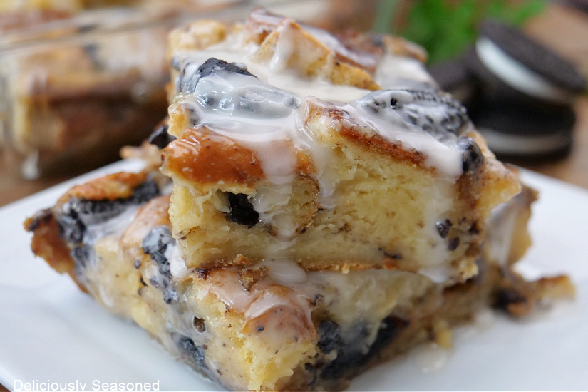 A horizontal photo of Oreo bread pudding on a white plate.