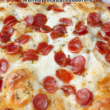 A white casserole dish filled with pizza monkey bread.