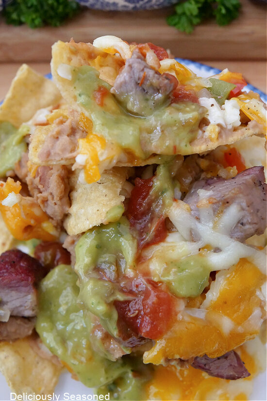 A close up of a serving of nachos.