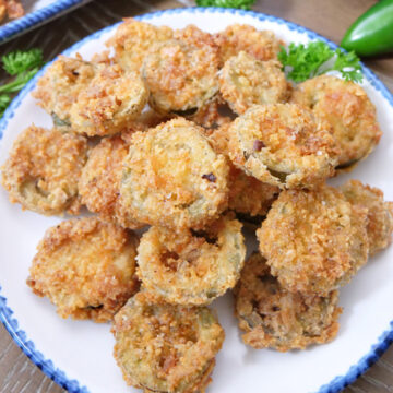 Fried jalapenos on a plate.