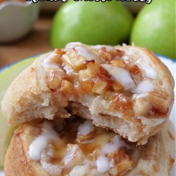 Two apple pizza rolls on a white plate with the title of the recipe at the top of the photo.