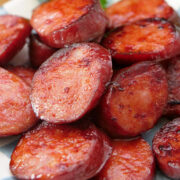A close up of cooked sliced smoked sausages.