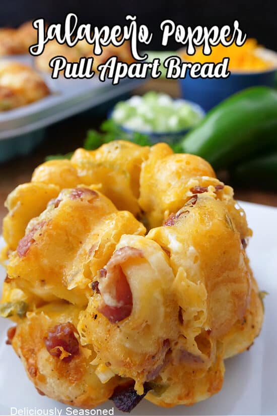 A mini jalapeno popper pull apart bread on a white plate.