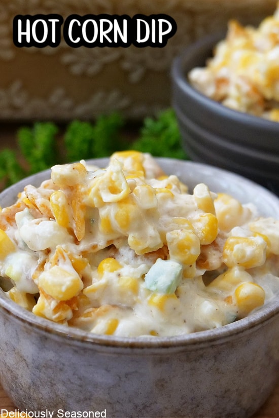 A grey bowl filled with corn dip.