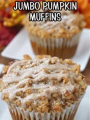 Two muffins on white plates.