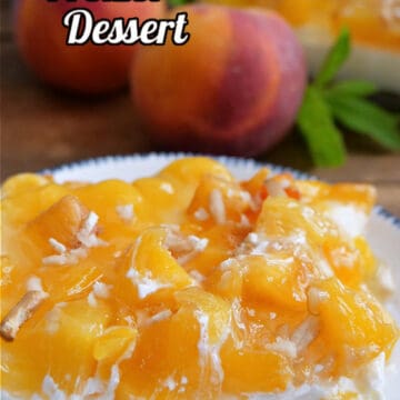 A slice of peach pretzel dessert on a white plate with fresh peaches in the background.