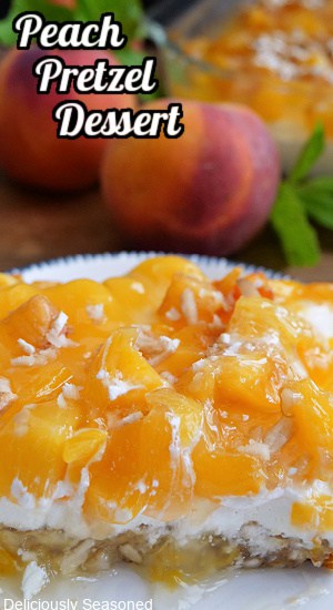 A piece of peach pretzel dessert on a white plate with the title of the recipe at the top of the photo.